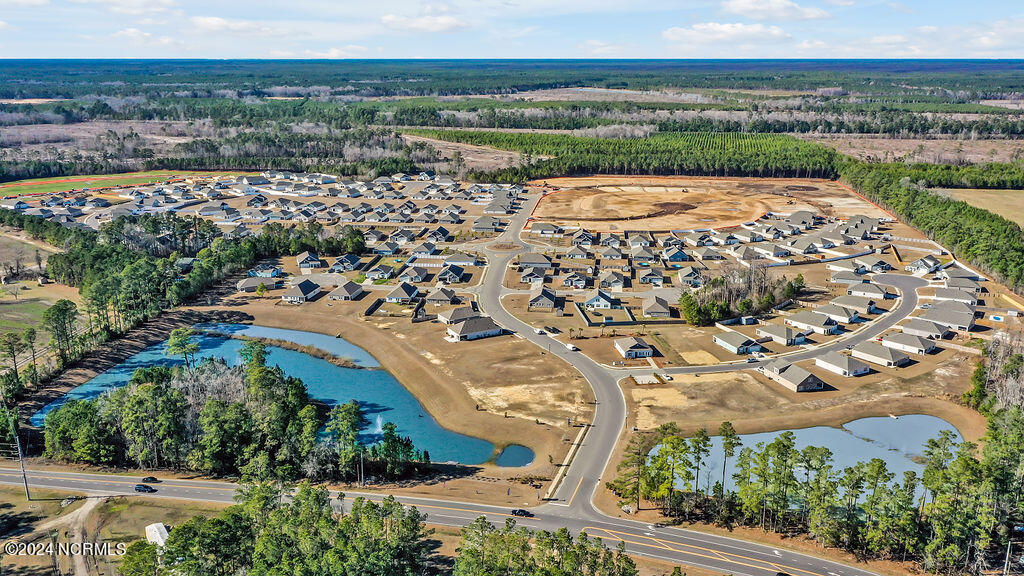 1607 Raptor Terrace Northeast, Unit LOT 321 Bolivia, NC 28422 - Photo 27 of 36 EagleCreekCommunityDrone-3