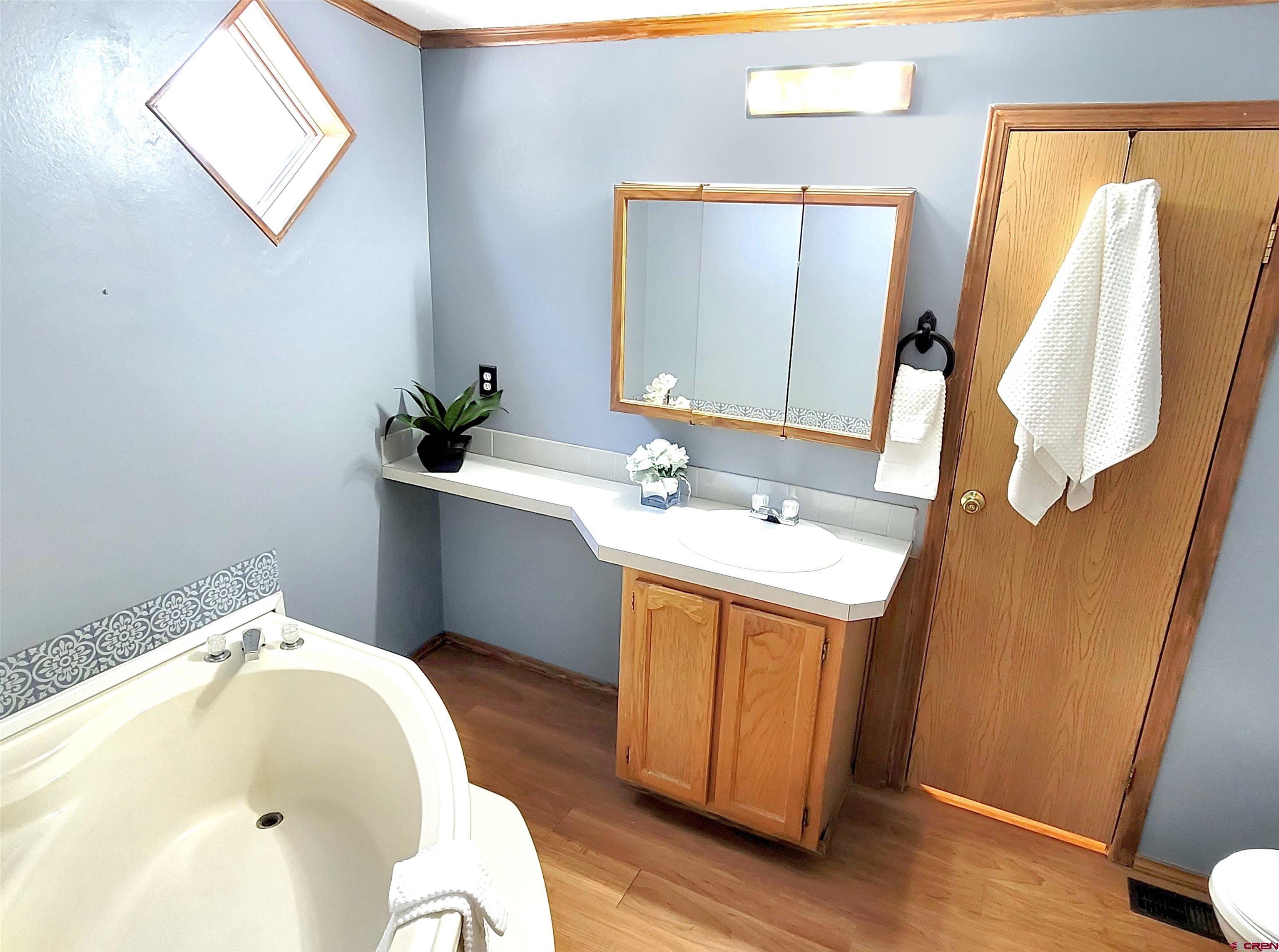 62302 David Road Olathe, CO 81425 - Photo 9 of 15 a bathroom with a sink and a mirror