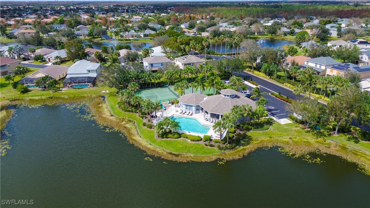 8876 Falcon Pointe Loop Fort Myers, FL 33912 - Photo 1 of 31 an aerial view of residential houses with outdoor space and swimming pool