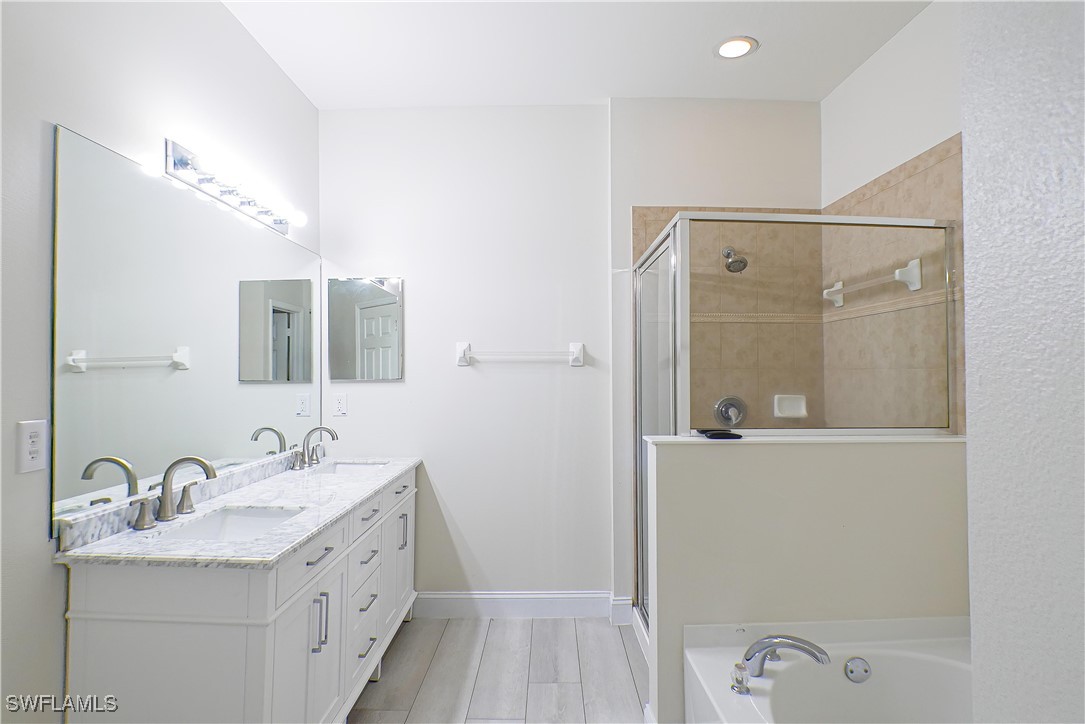 8876 Falcon Pointe Loop Fort Myers, FL 33912 - Photo 12 of 31 a bathroom with a granite countertop sink mirror and double