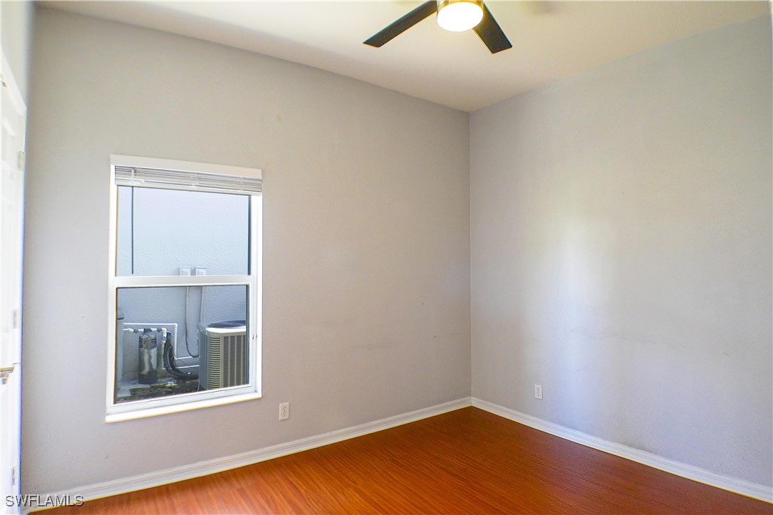 8876 Falcon Pointe Loop Fort Myers, FL 33912 - Photo 20 of 31 an empty room with a window and ceiling fan