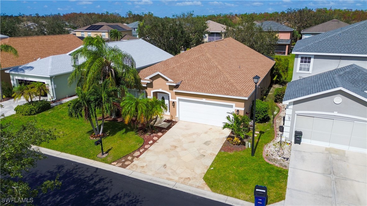 8876 Falcon Pointe Loop Fort Myers, FL 33912 - Photo 2 of 31 an aerial view of a house