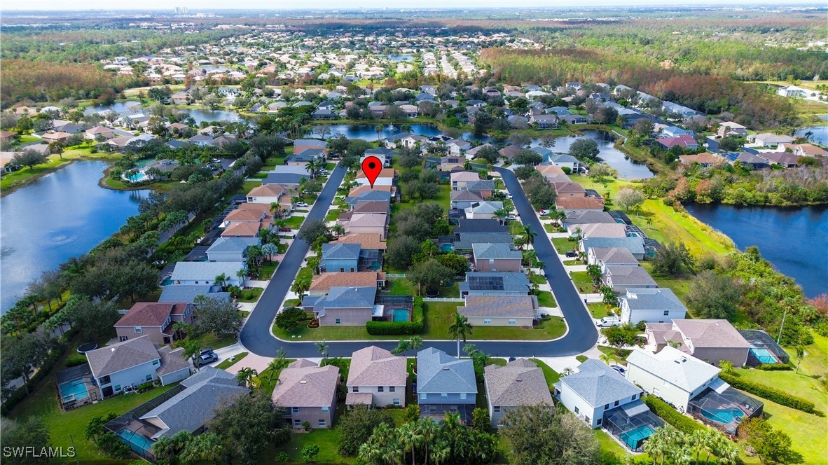 8876 Falcon Pointe Loop Fort Myers, FL 33912 - Photo 29 of 31 an aerial view of multiple house