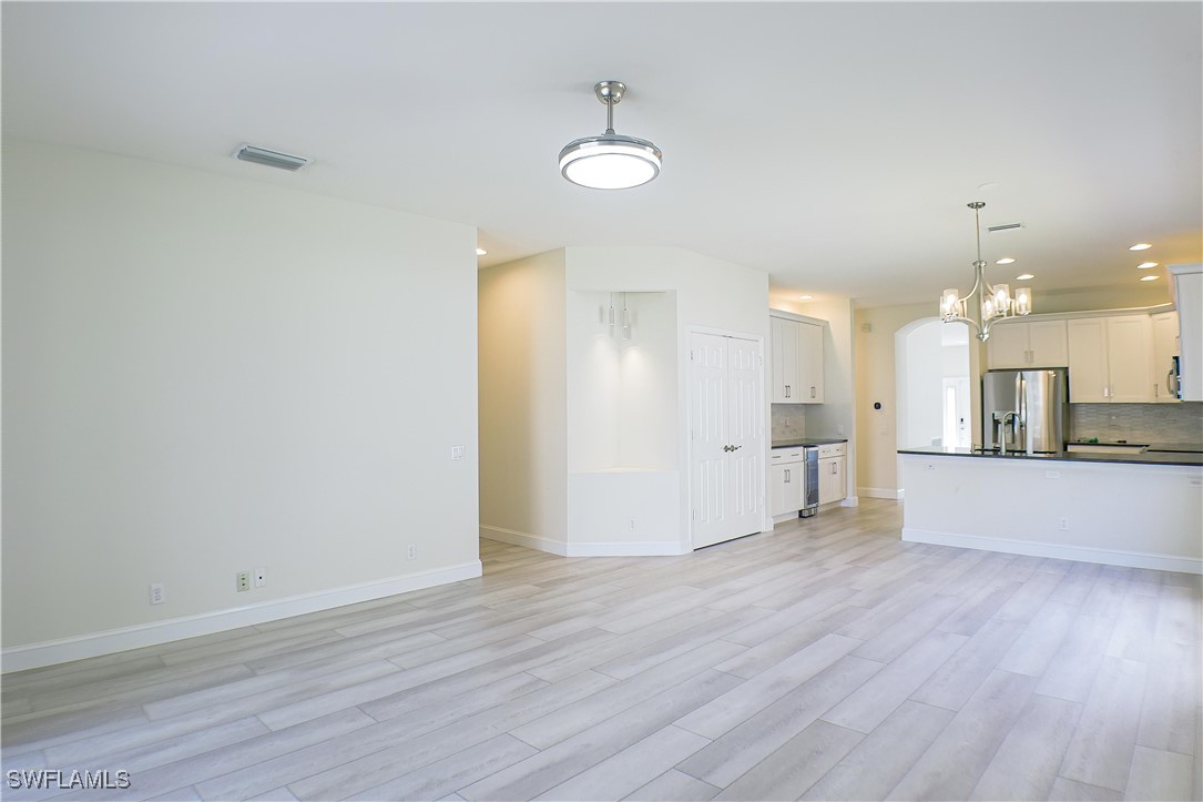 8876 Falcon Pointe Loop Fort Myers, FL 33912 - Photo 6 of 31 a view of a kitchen and wooden floor