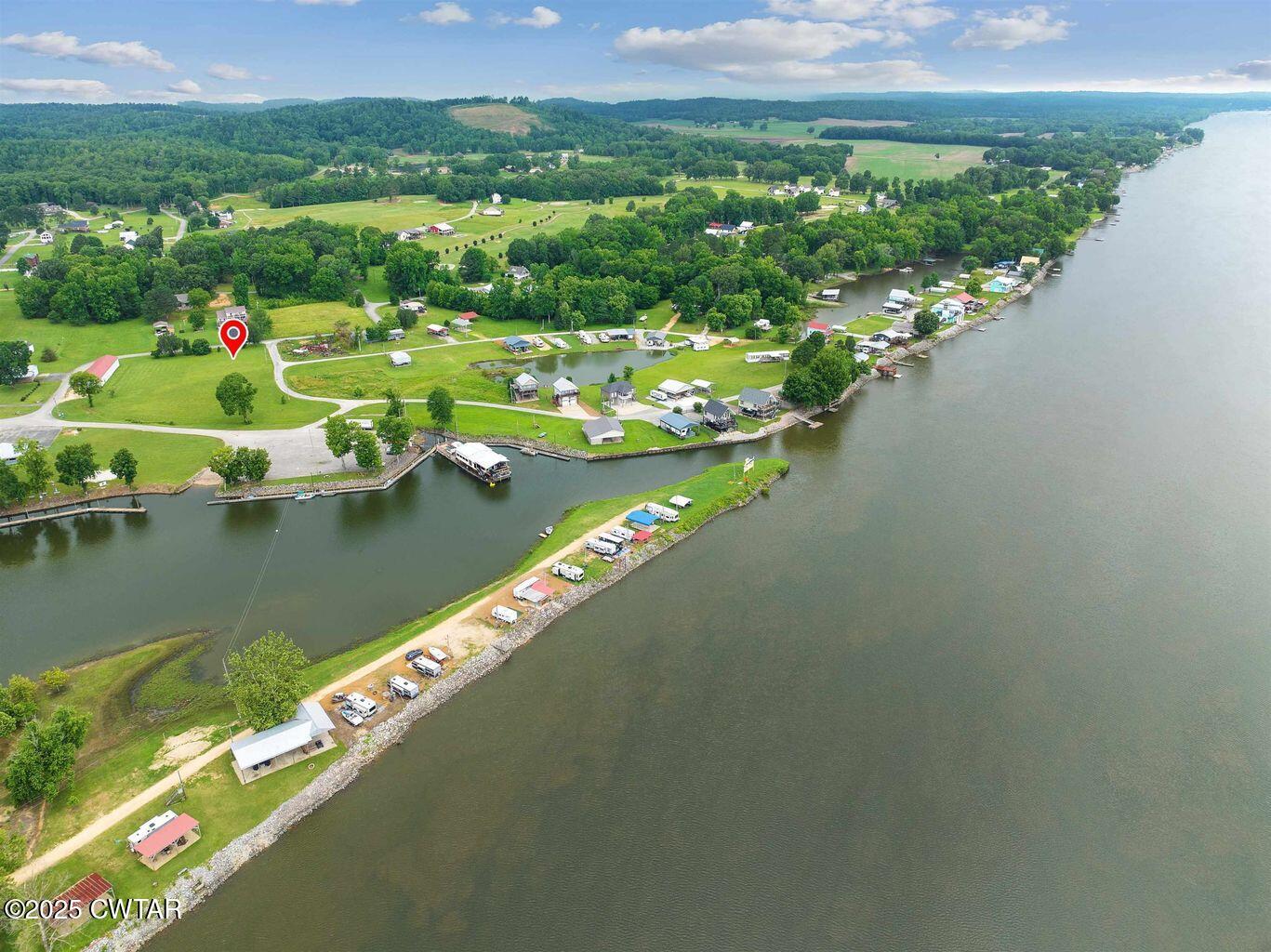 20 Ellen Lane Decaturville, TN 38329 - Photo 6 of 12 a view of a lake with a city