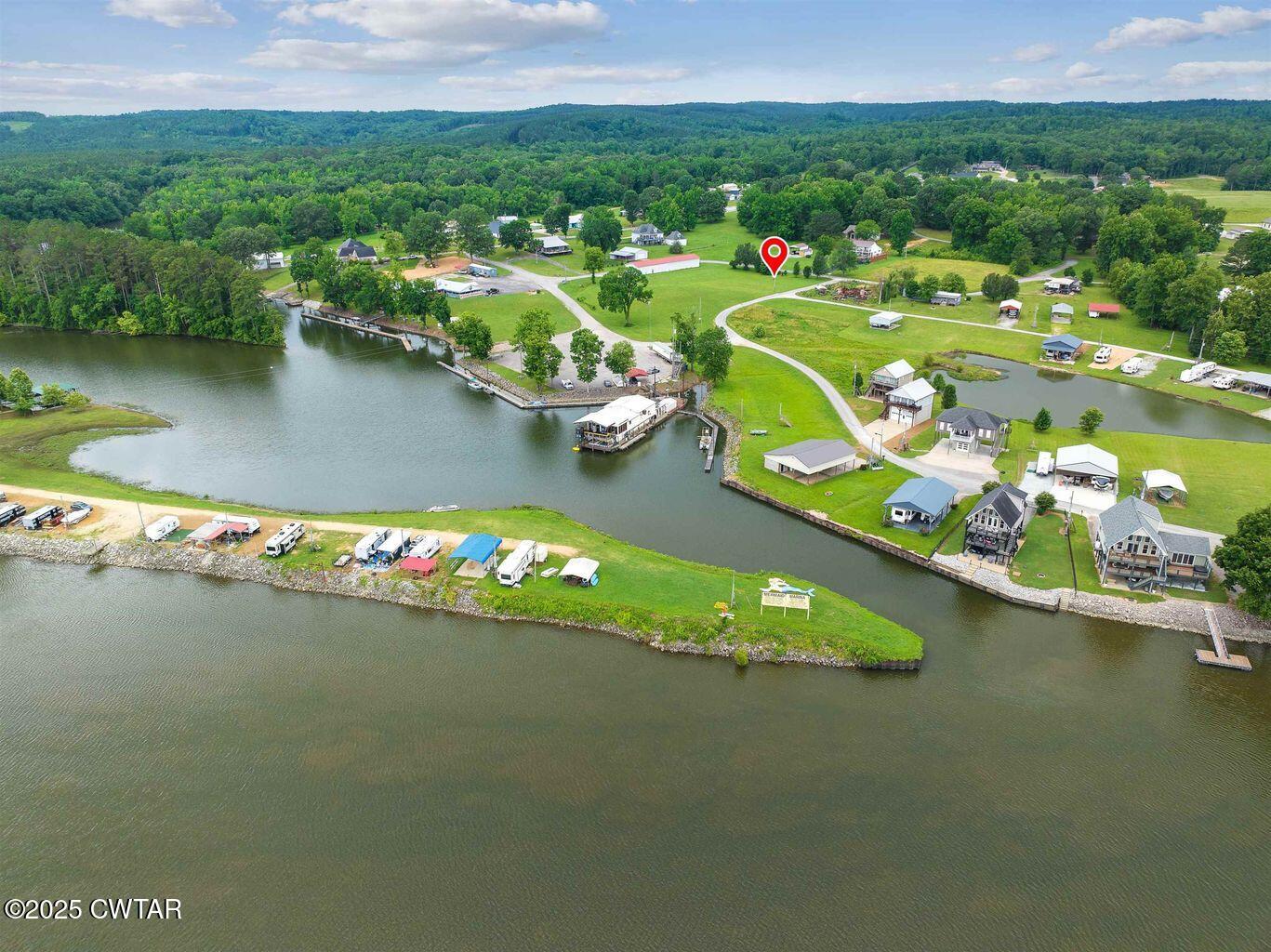 20 Ellen Lane Decaturville, TN 38329 - Photo 8 of 12 a view of a lake with a houses