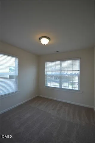 a bathroom with a double vanity sink mirror and shower