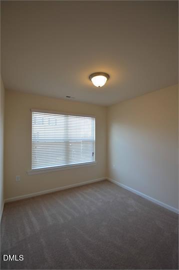 2021 Hayes Lane Holly Springs, NC 27540 - Photo 14 of 25 an empty room with a empty space and a window