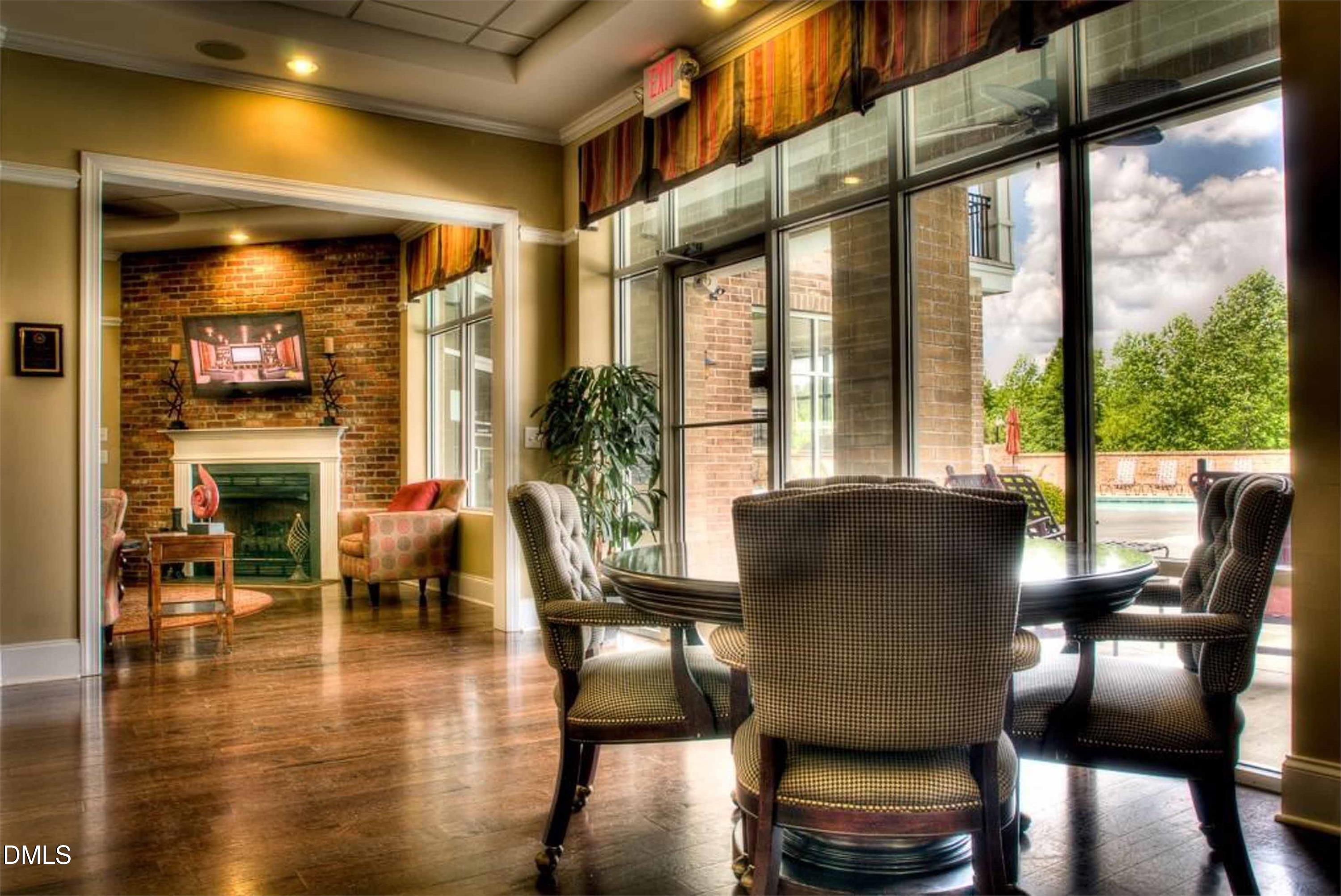 2021 Hayes Lane Holly Springs, NC 27540 - Photo 18 of 25 a view of a dining room with furniture window and wooden floor