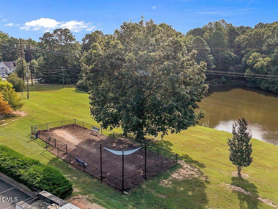 2021 Hayes Lane Holly Springs, NC 27540 - Photo 20 of 25 a view of a lake with a mountain in the background