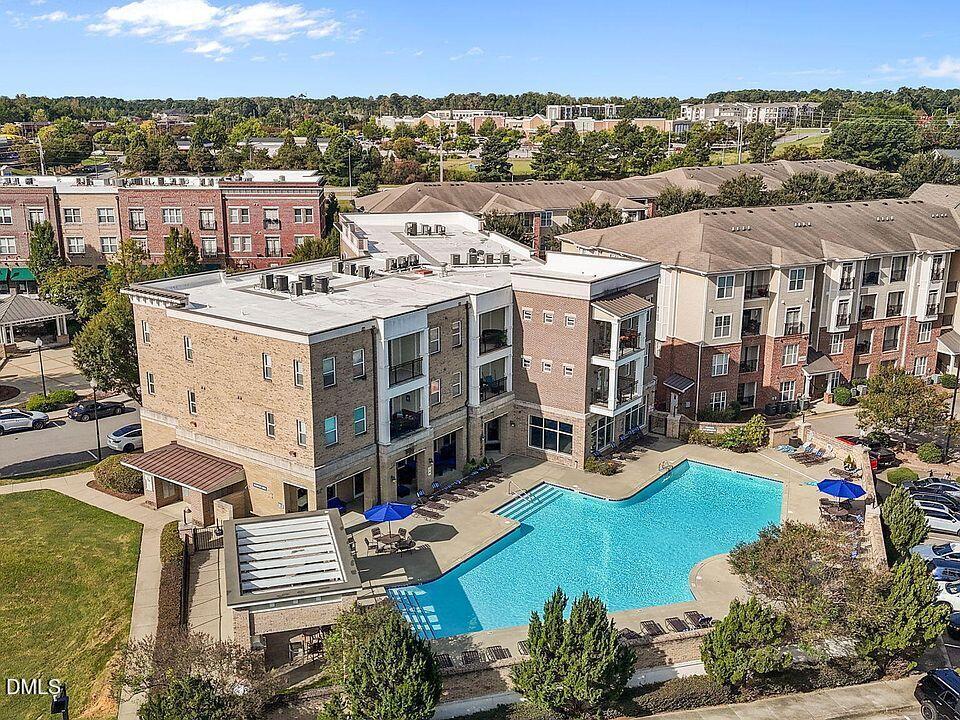 2021 Hayes Lane Holly Springs, NC 27540 - Photo 21 of 25 a view of a city with lawn chairs