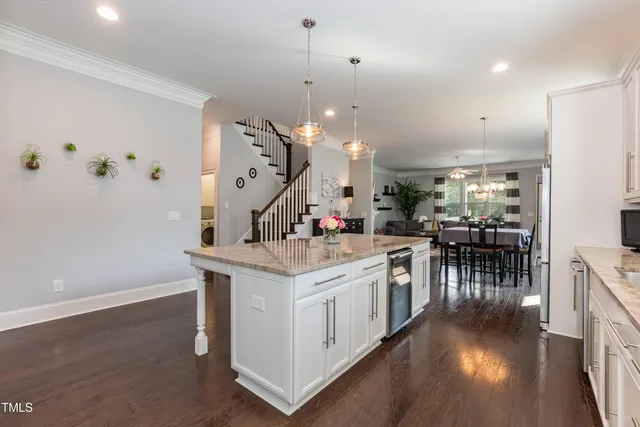a view of washer and dryer with kitchen in the background