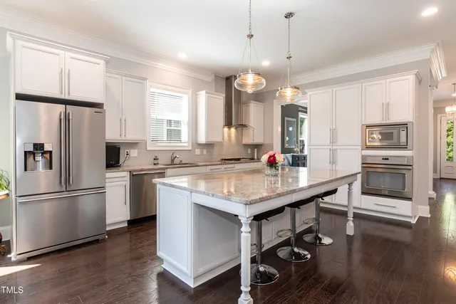 a bedroom with a bed and a ceiling fan