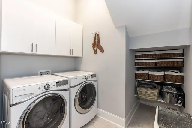 a view of a terrace with wooden floor and a houses