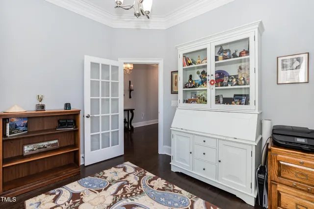 a sign that is sitting in front of flowers