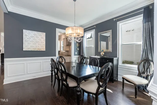 a bedroom with a bed and a television