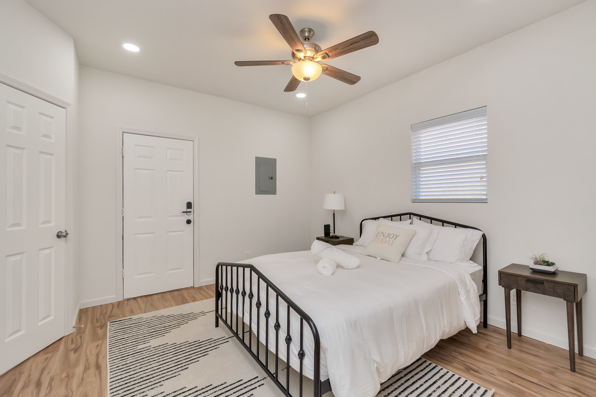 1812 Wheeler Avenue Houston, TX 77004 - Photo 15 of 34 a bedroom with a bed and a chandelier