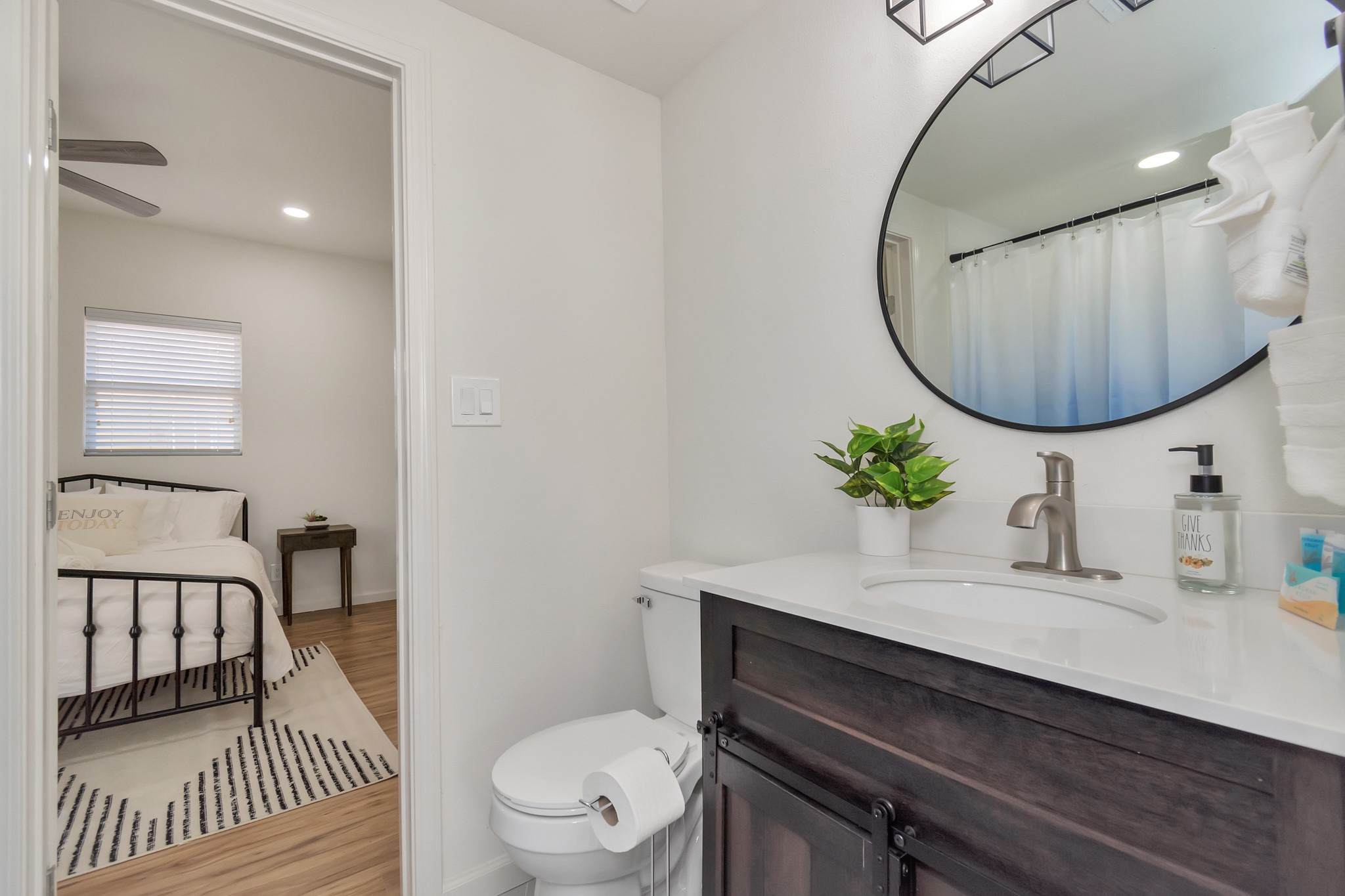 1812 Wheeler Avenue Houston, TX 77004 - Photo 16 of 34 a bathroom with a sink a toilet and a mirror
