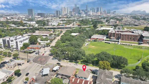 a view of kitchen with cabinets and wooden floor