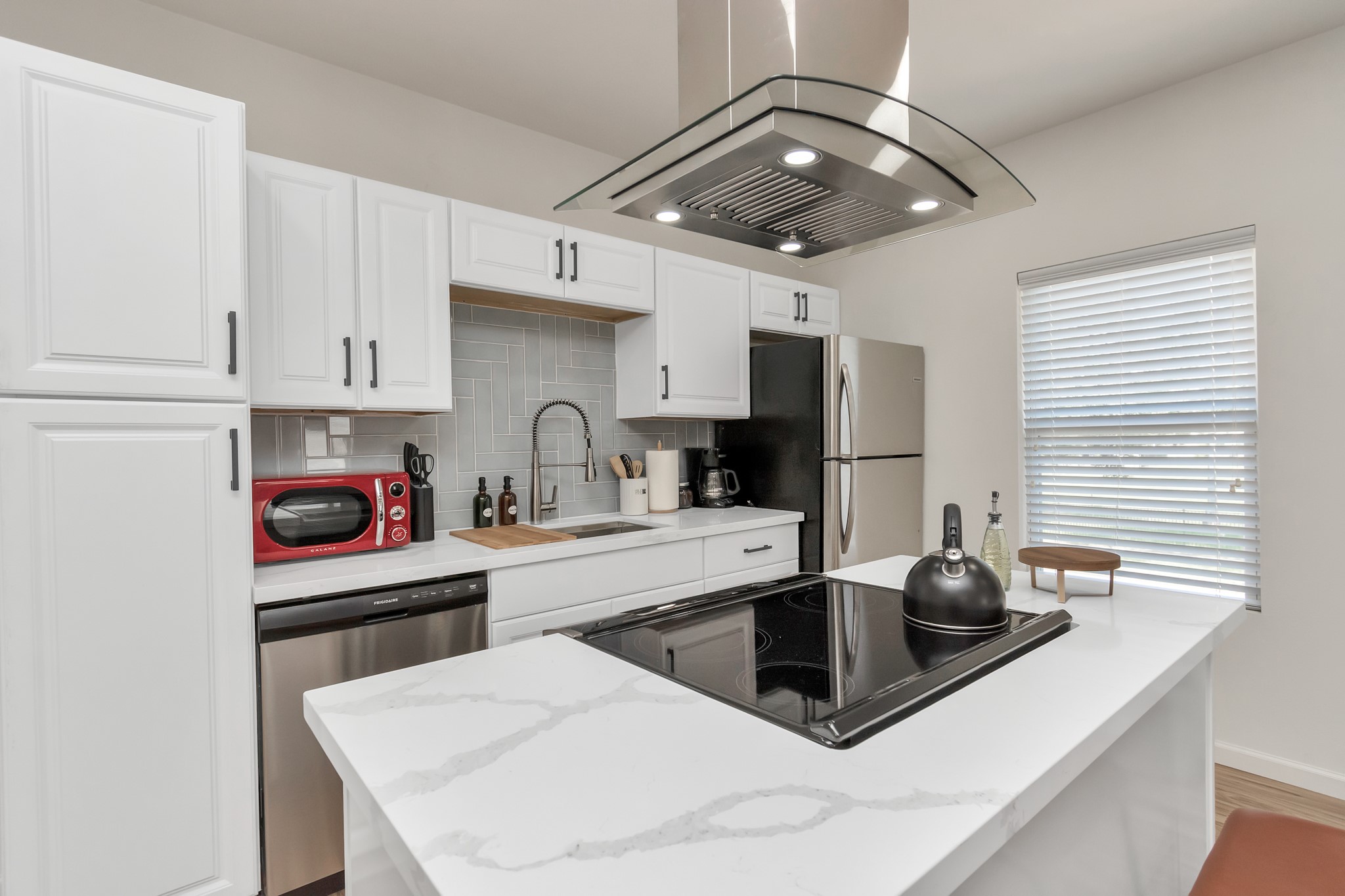 1812 Wheeler Avenue Houston, TX 77004 - Photo 21 of 34 a kitchen with stainless steel appliances a sink a stove a refrigerator and cabinets