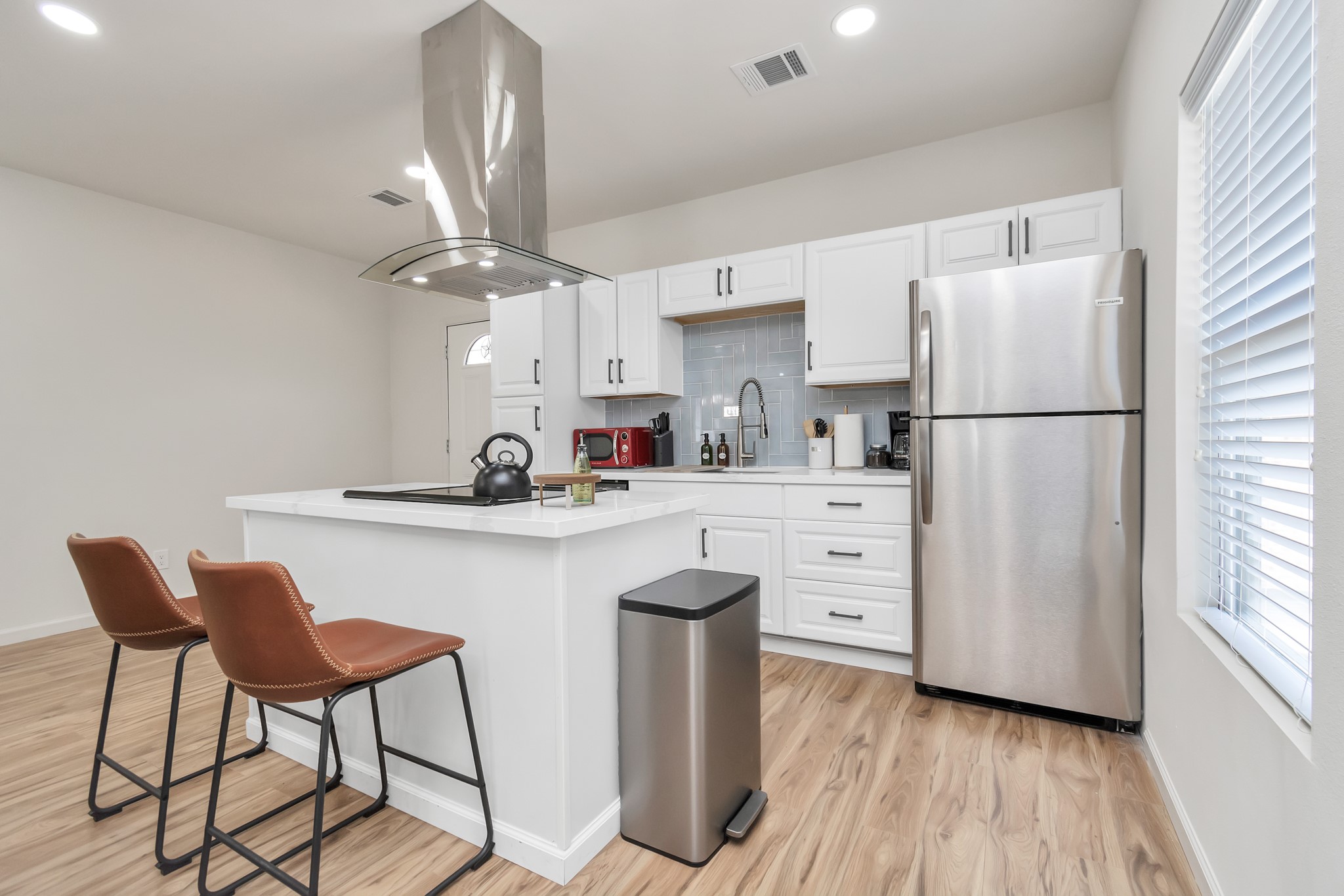 1812 Wheeler Avenue Houston, TX 77004 - Photo 26 of 34 a kitchen with white cabinets and white appliances