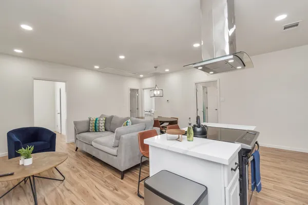 a large bed sitting in a bedroom next to a window