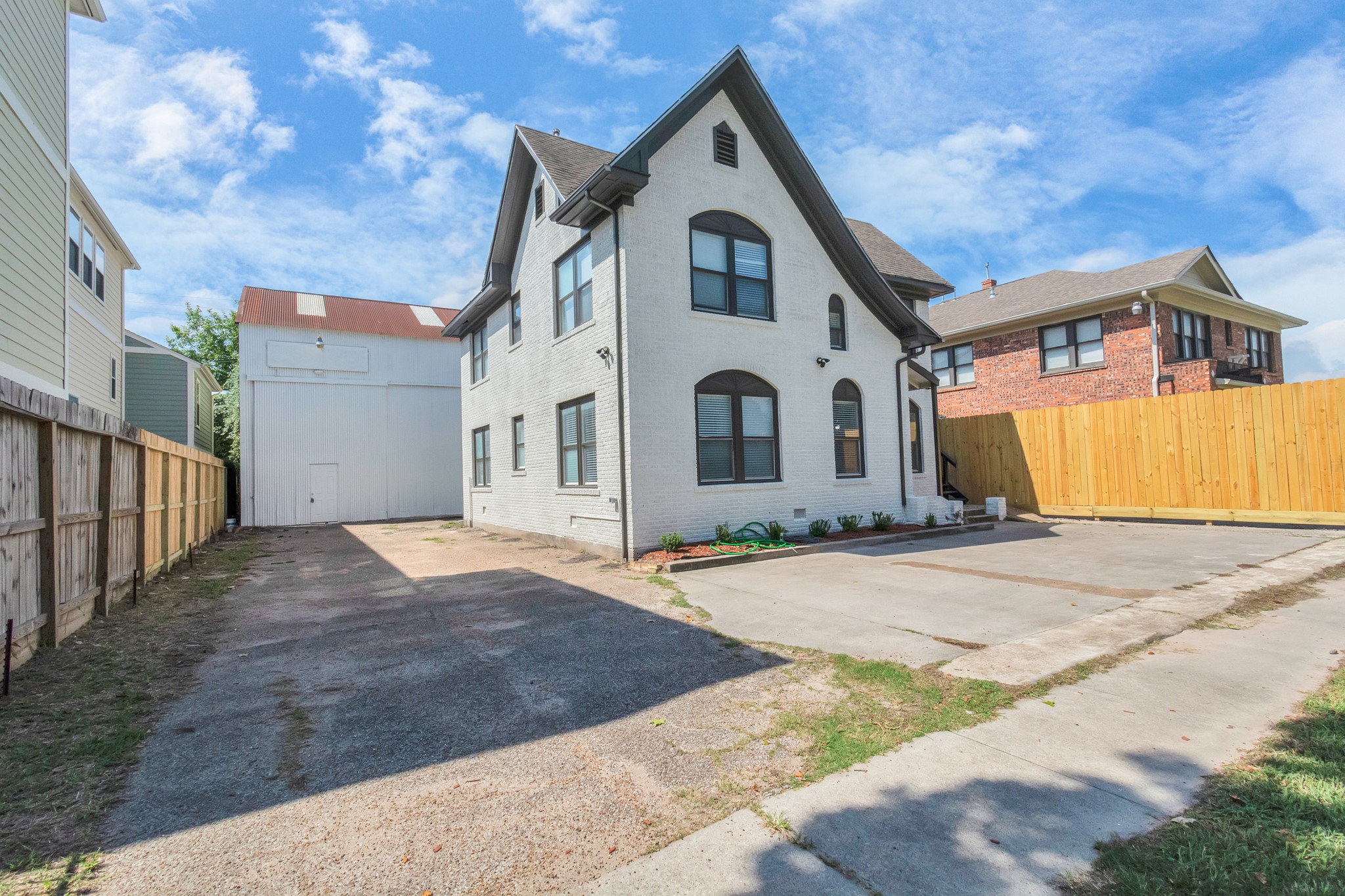 1812 Wheeler Avenue Houston, TX 77004 - Photo 3 of 34 a front view of a house with a yard and garage