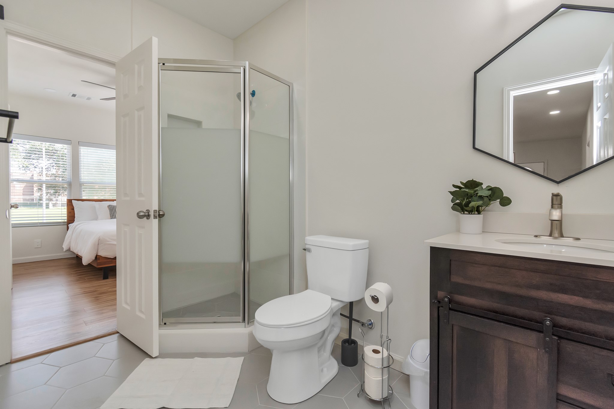 1812 Wheeler Avenue Houston, TX 77004 - Photo 34 of 34 a bathroom with a toilet a sink and mirror
