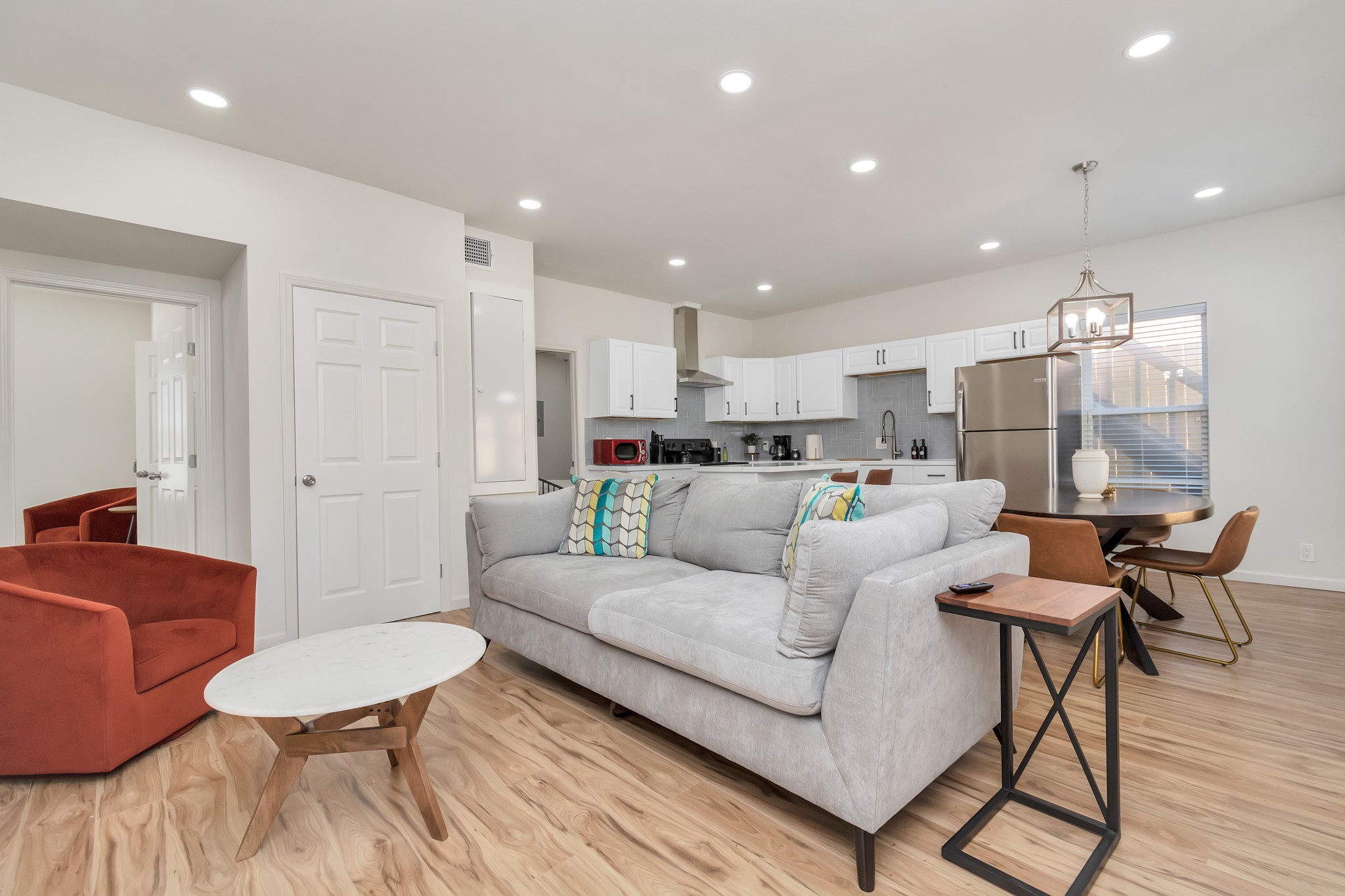 1812 Wheeler Avenue Houston, TX 77004 - Photo 6 of 34 a living room with furniture and a dining table with kitchen view