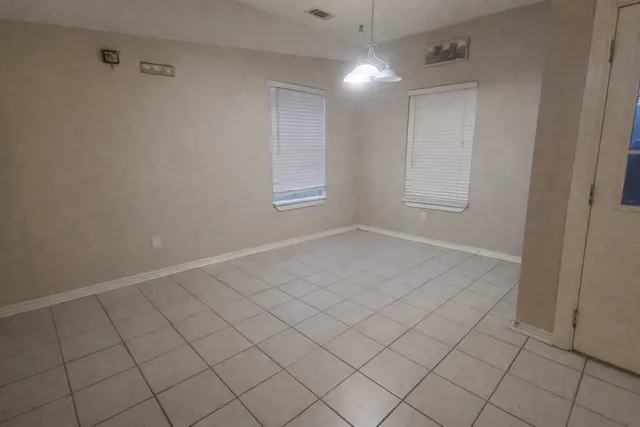 a view of an empty room and window