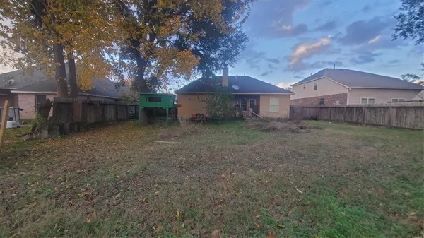 a house with a large tree in front of it