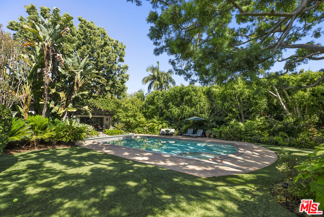 710 North Maple Drive Beverly Hills, CA 90210 - Photo 15 of 18 a view of a yard with a tree