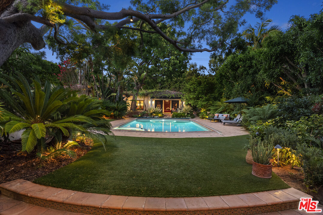 710 North Maple Drive Beverly Hills, CA 90210 - Photo 17 of 18 a view of a house with a yard