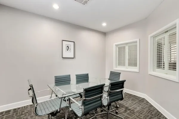 a workspace with furniture and a window