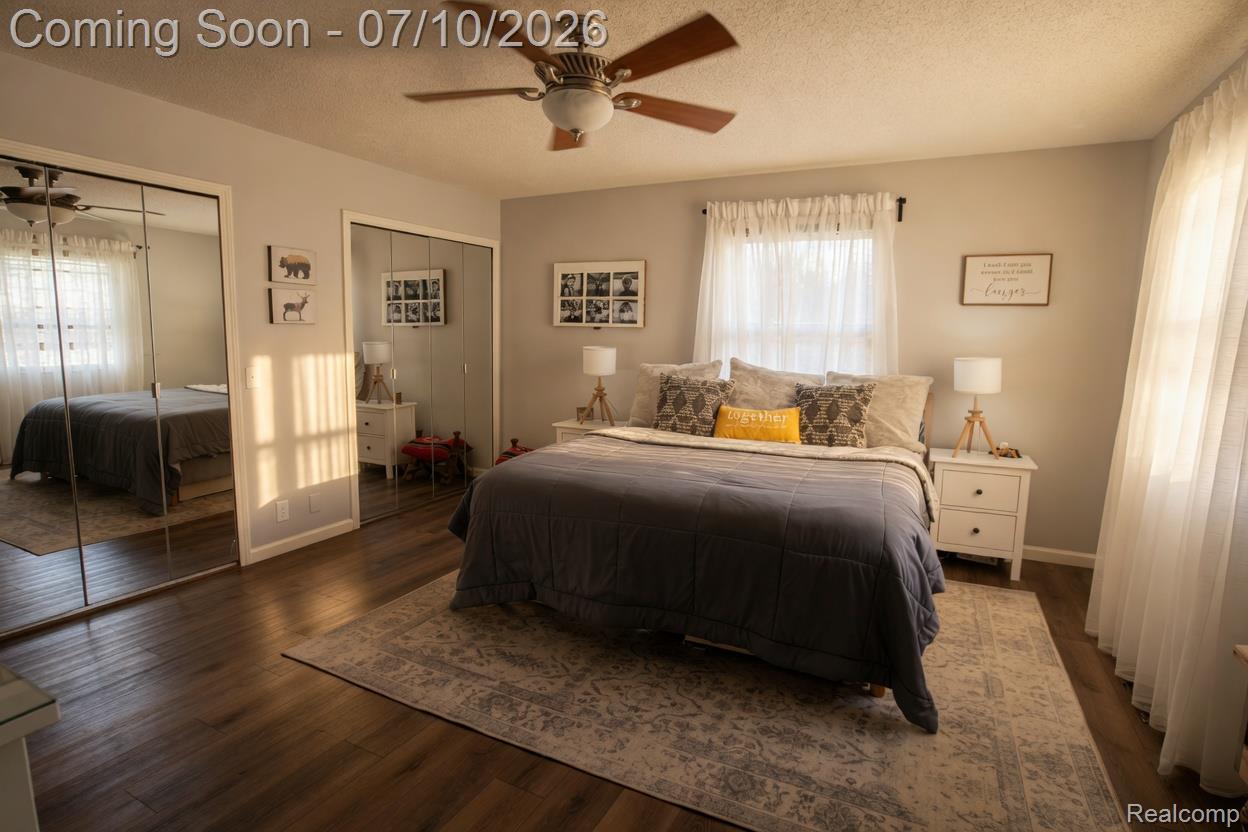 5278 Skelton Road Columbiaville, MI 48421 - Photo 58 of 64 Interior room featuring wood-finish flooring, light grey wall paint, and a ceiling fan with integrated lighting