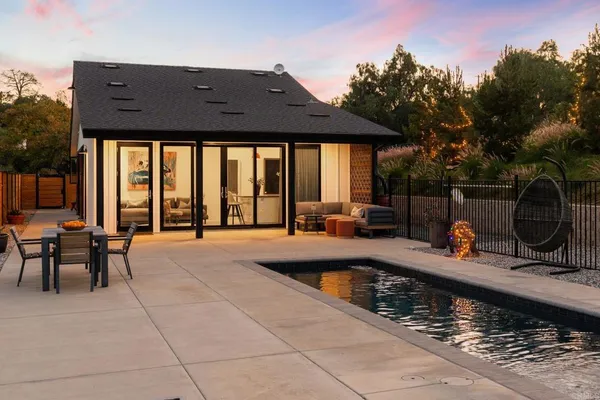a view of a swimming pool with a lounge chair