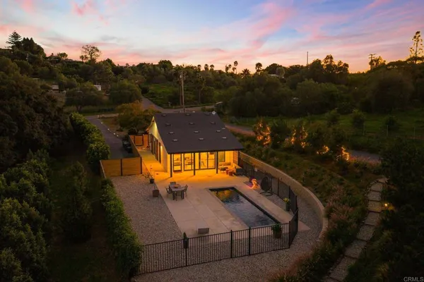 aerial view of a house with a yard