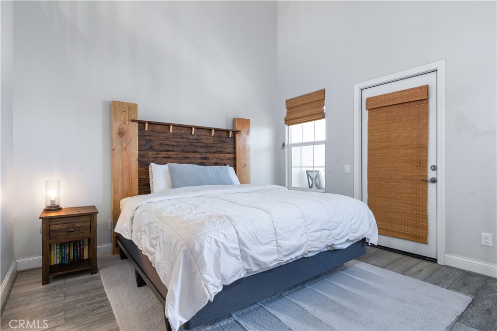 9354 Riberena Circle Atascadero, CA 93422 - Photo 30 of 47 a bedroom with a bed and wooden floor