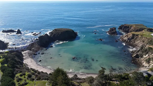 a living room with lots of furniture and a chandelier