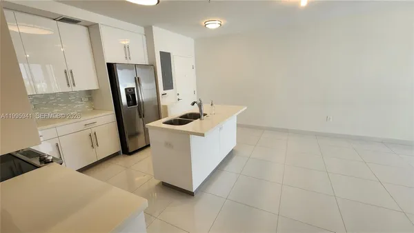 a view of a kitchen with utility and utility room