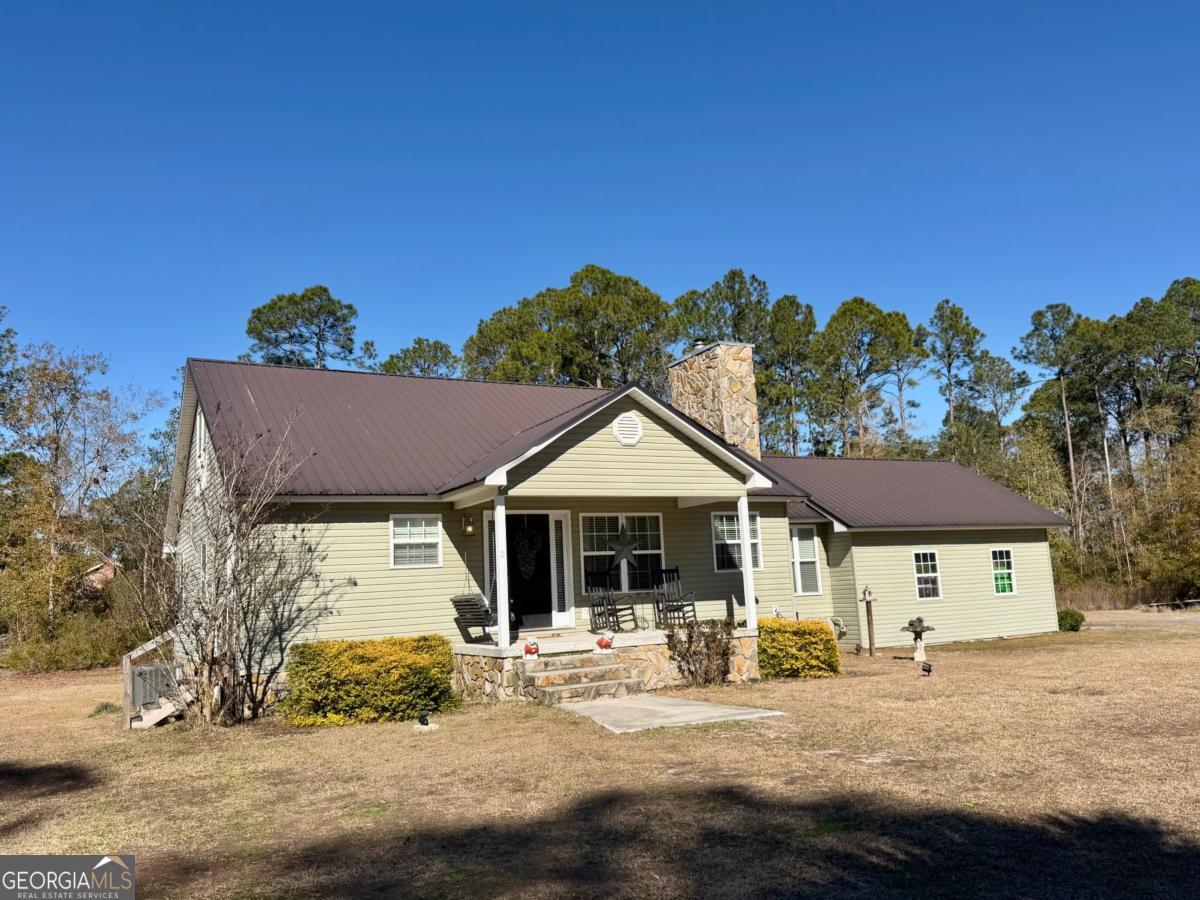a front view of a house with sitting space