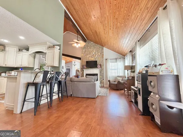 a view of kitchen with furniture and wooden floor