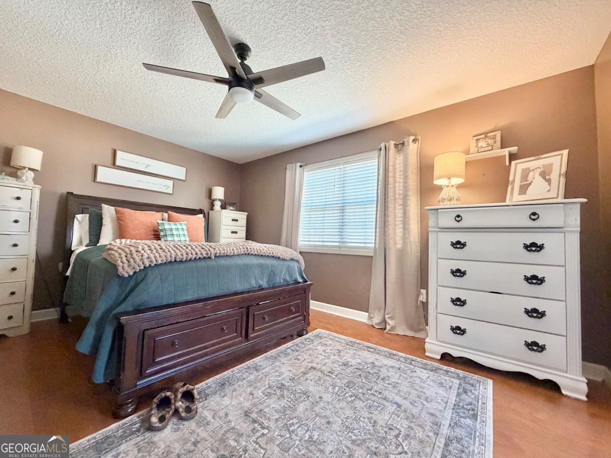 3231 Pear Avenue Patterson, GA 31557 - Photo 31 of 43 a bedroom with a bed and a dresser