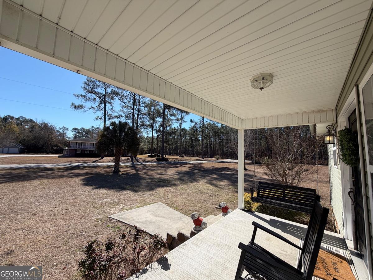 3231 Pear Avenue Patterson, GA 31557 - Photo 4 of 43 a backyard of a house with basket ball court