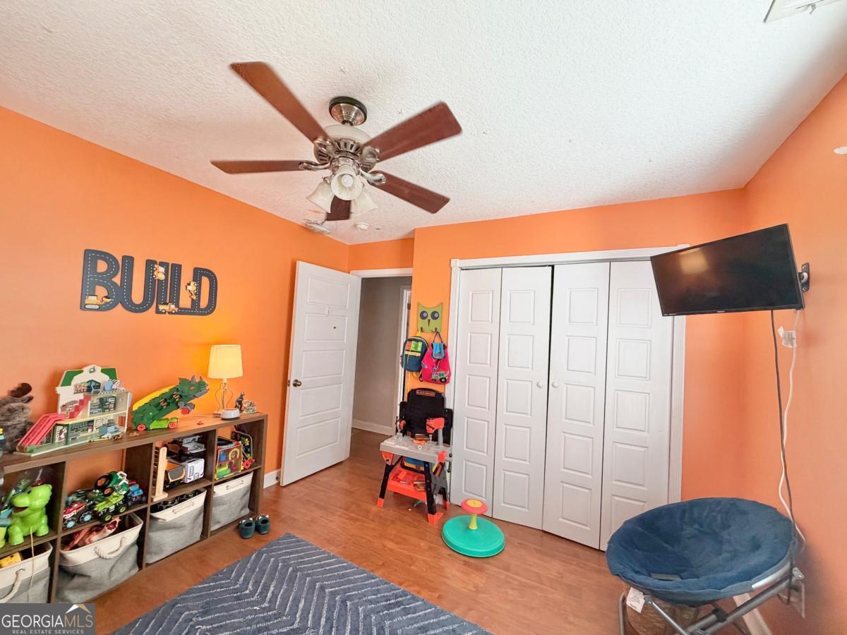 3231 Pear Avenue Patterson, GA 31557 - Photo 41 of 43 a living room with furniture and wooden floor