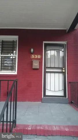 a view of an empty room with windows