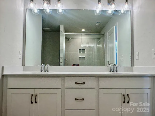a bathroom with a sink and mirror