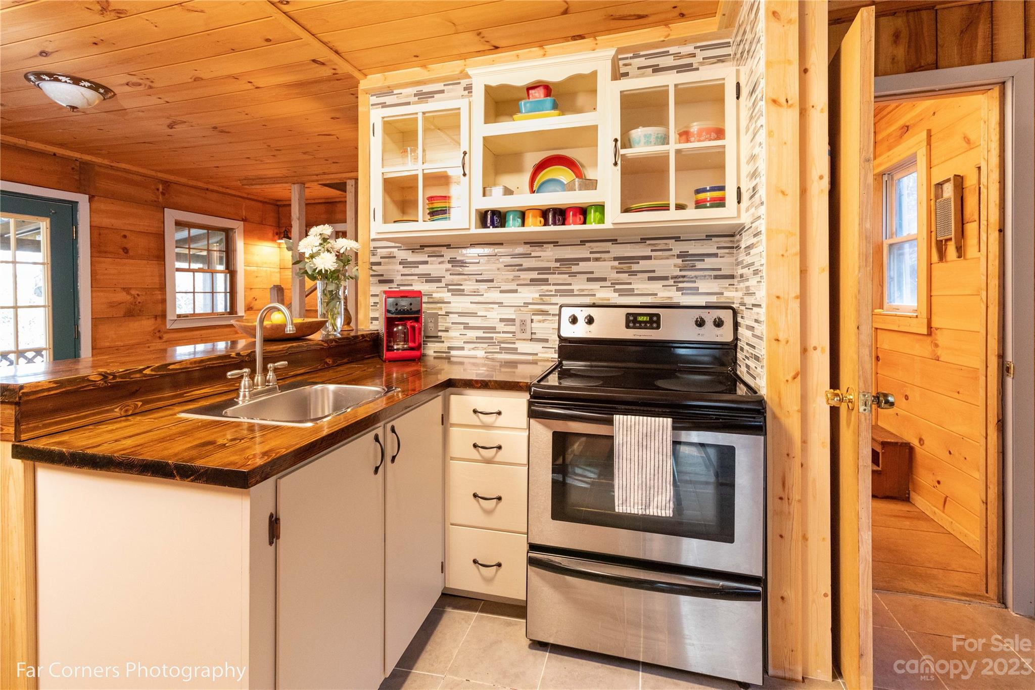 523 Spring Lake Road Maggie Valley, NC 28751 - Photo 2 of 25 a kitchen with stainless steel appliances granite countertop a stove and a sink
