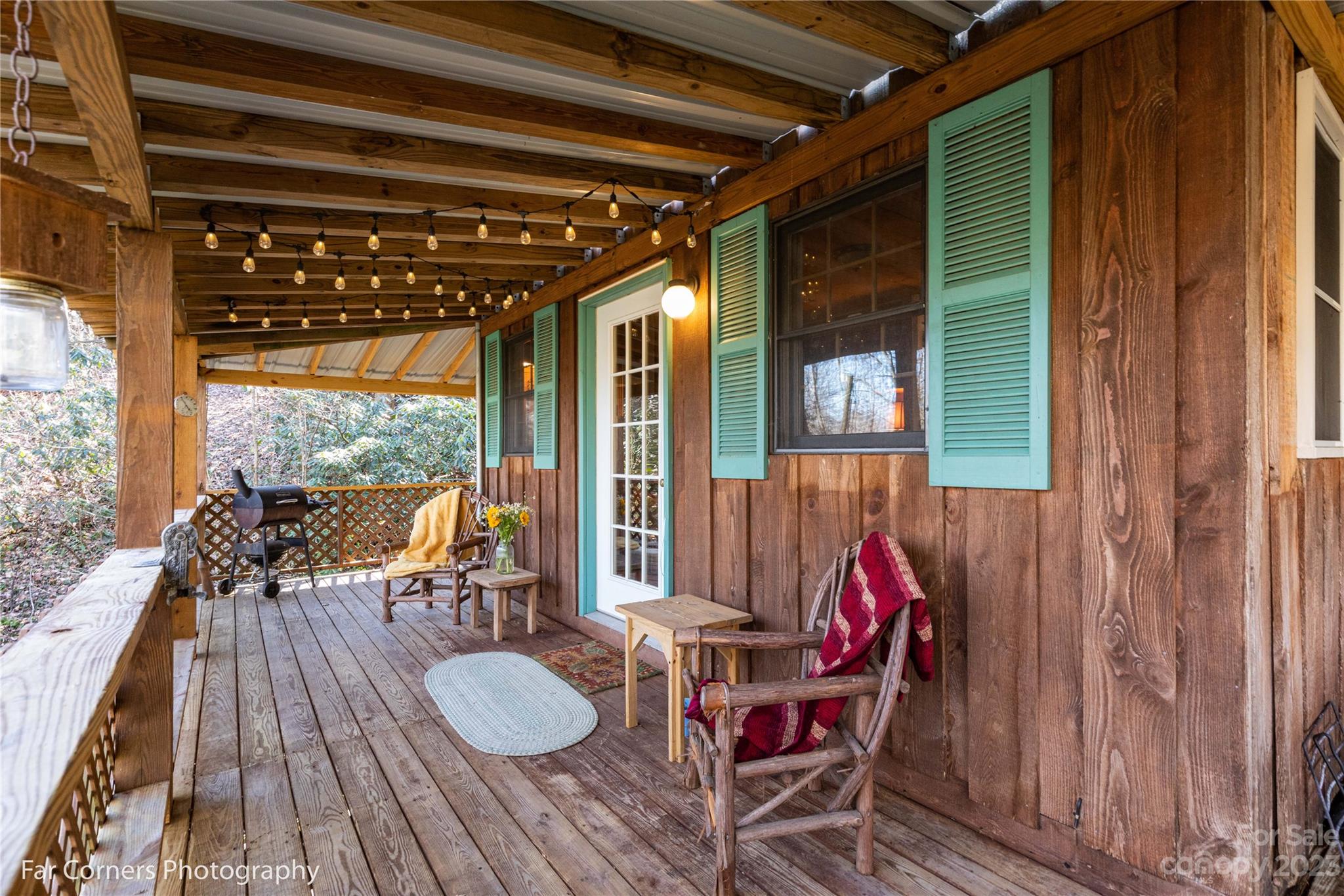 523 Spring Lake Road Maggie Valley, NC 28751 - Photo 8 of 25 a patio with wooden floors and furniture