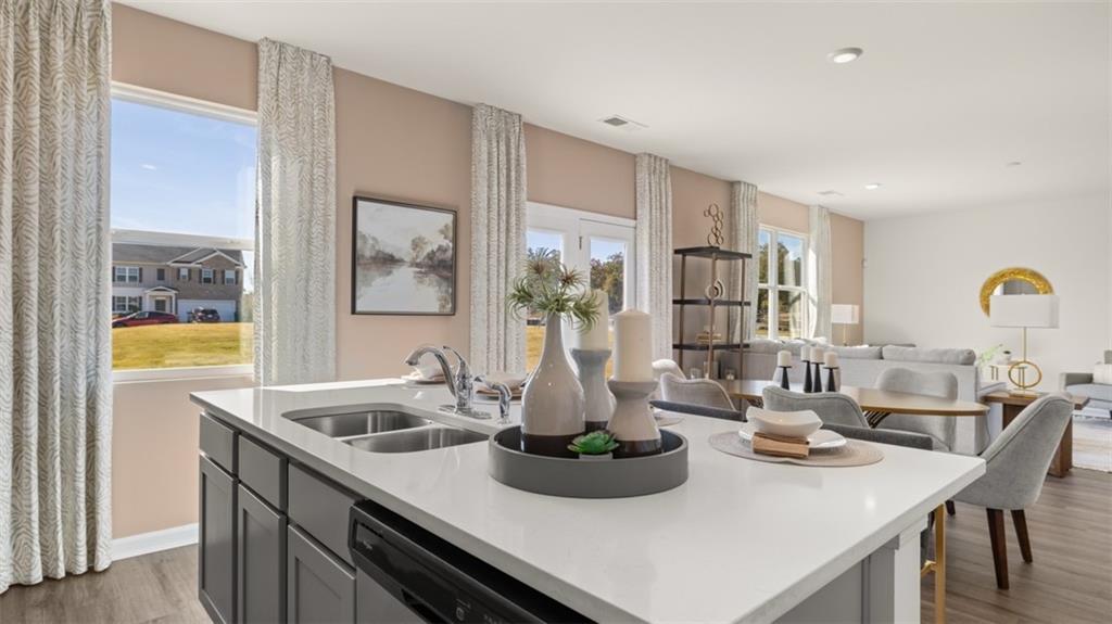 182 Aster Avenue Locust Grove, GA 30248 - Photo 14 of 48 a kitchen with a sink and cabinets